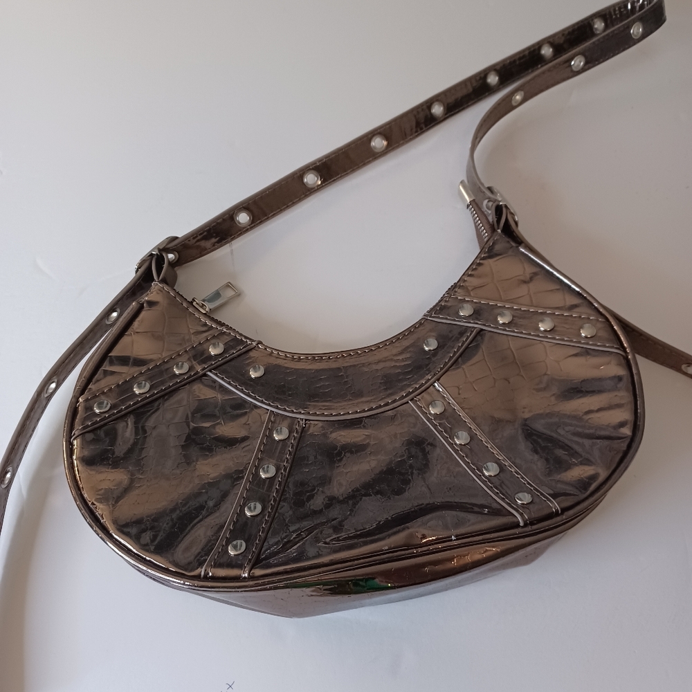 Metallic micro bag with adjustable long strap Studs on front